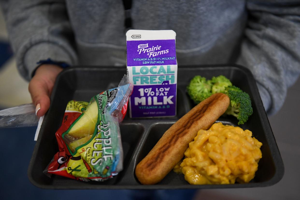 A fourth grade student holds her lunch tray on Friday, Sept. 15, 2023 at Eugene Field A+ Elementary in Sioux Falls, South Dakota.