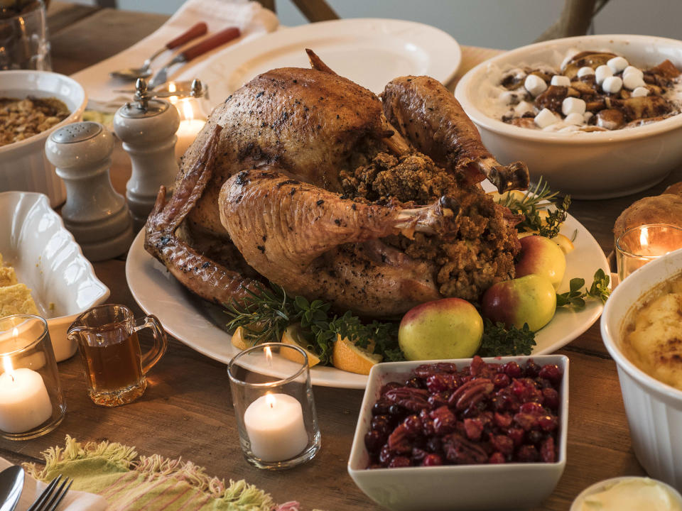 A photo of a thanksgiving turkey and fixings. (Image via Getty Images)