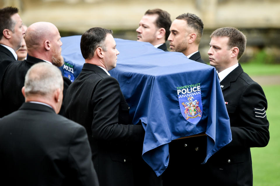 The PC's coffin is draped in a police flag as it is carried into the church in Berkshire. (PA)