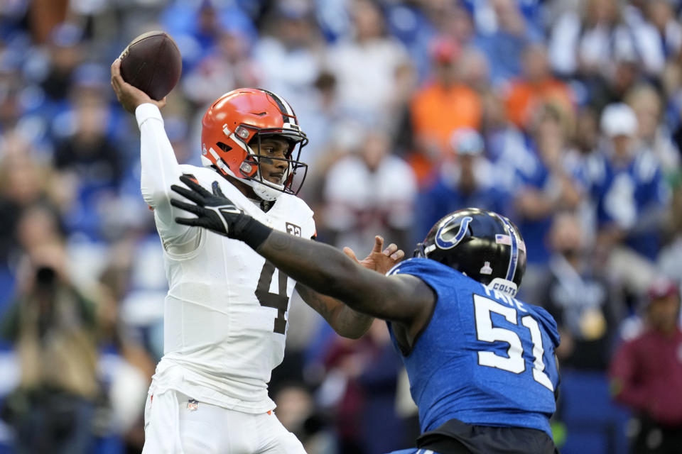 Cleveland Browns quarterback Deshaun Watson (4) throws a pass over Indianapolis Colts defensive end Kwity Paye (51) during the first half of an NFL football game, Sunday, Oct. 22, 2023, in Indianapolis. (AP Photo/Michael Conroy)