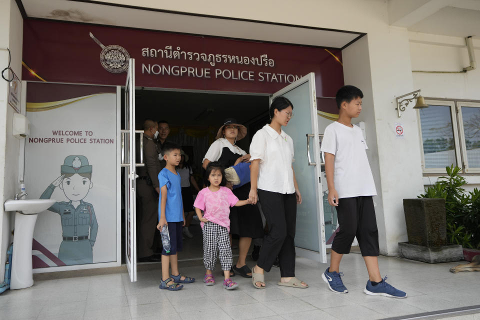 Members of the Shenzhen Holy Reformed Church, also known as the Mayflower Church, leave from the Nongprue police station on their way to Pattaya Provincial Court in Pattaya, Thailand, Friday, March 31, 2023. More than 60 members of a Chinese Christian church have been detained in Thailand, supporters said Friday, raising fears they may be returned to their home country, where they face possible persecution. (AP Photo/Sakchai Lalit)