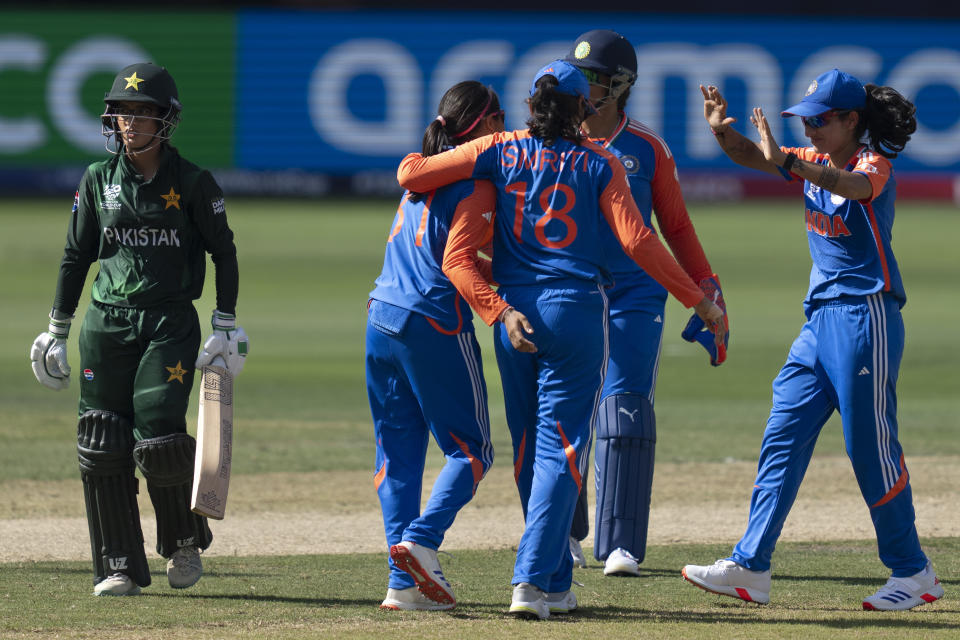 Indian players celebrate the wicket of Pakistan's Aliya Riaz, left, during the ICC Women's T20 World Cup 2024 match between Pakistan and India at Dubai International Stadium, United Arab Emirates, Sunday, Oct. 6, 2024. (AP Photo/Altaf Qadri)