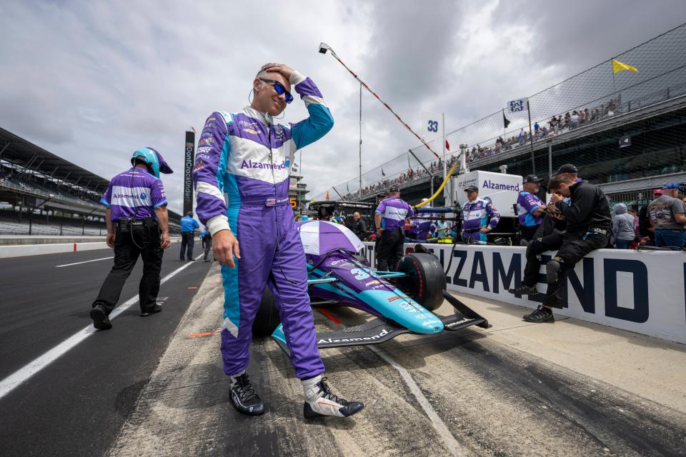 Ed Carpenter walks around Indianapolis Motor Speedway his car before Friday's Carb Day practice for the 106th Indianapolis.