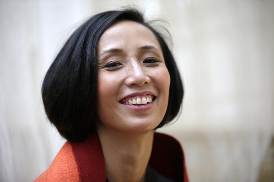 Jiang Qiong Er, Shang Xia's artistic director and chief executive, poses during a Chinese tea ceremony in Paris September 11, 2013. Shang Xia, the Chinese-born brand backed by French luxury goods group Hermes, opened its first shop outside its home market in Paris on Wednesday to test appetite among non-Chinese customers for its handcrafted products. The brand is trying to build a business centred on the revival of traditional Chinese crafts such as porcelain, cashmere felt and furniture, that were all but nearly destroyed by China's proletarian Cultural Revolution. REUTERS/Jacky Naegelen (FRANCE - Tags: FASHION BUSINESS)