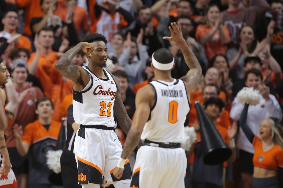 Oklahoma State Cowboys forward Kalib Boone (22) celebrates with guard Avery Anderson III (0) during a men's college basketball game between the Oklahoma State Cowboys (OSU) and the Ole Miss Rebels at Gallagher-Iba Arena in Stillwater, Okla., Saturday, Jan. 28, 2023. 