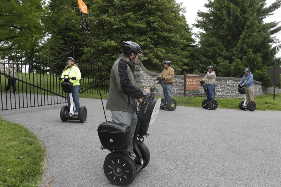 In this Friday, May 24, 2013 photo, visitors riding Segways tour Gettysburg National Military Park, in Gettysburg, Pa. Tens of thousands of visitors are expected for the 10-day schedule of events that begin June 29 to mark 150th anniversary of the Battle of Gettysburg that took that took place July 1-3, 1863. (AP Photo/Matt Rourke)