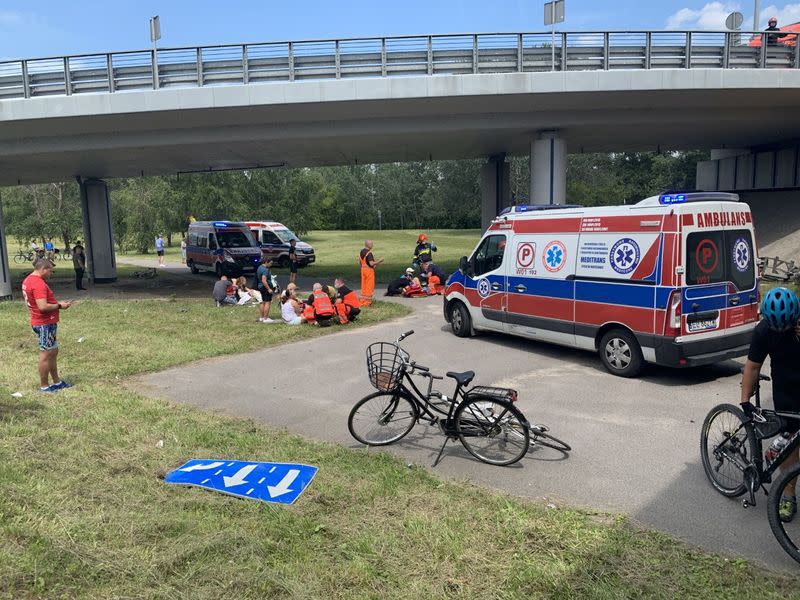 First responders attend to the scene of a public bus crash in Warsaw