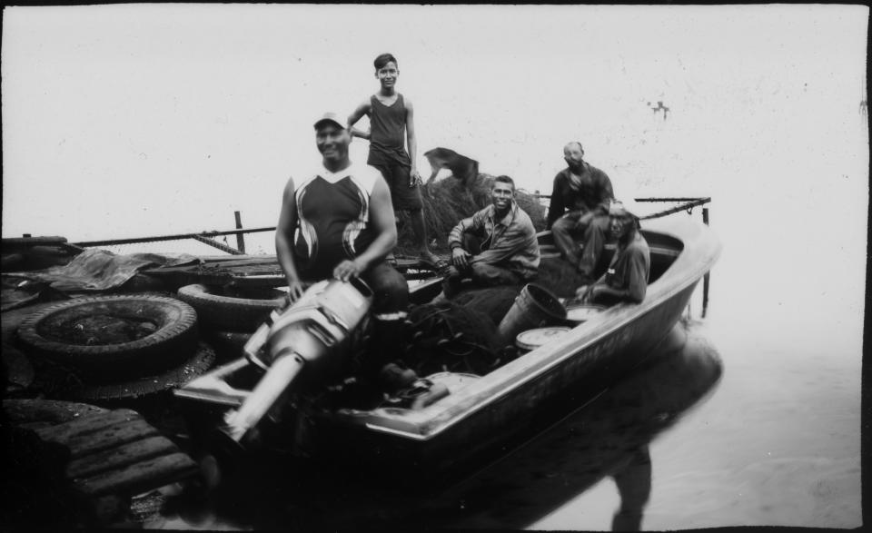 Fishermen pose for a photo before crab fishing in the oil-contaminated Lake Maracaibo near Cabimas, Venezuela. (Photo: Rodrigo Abd/AP)