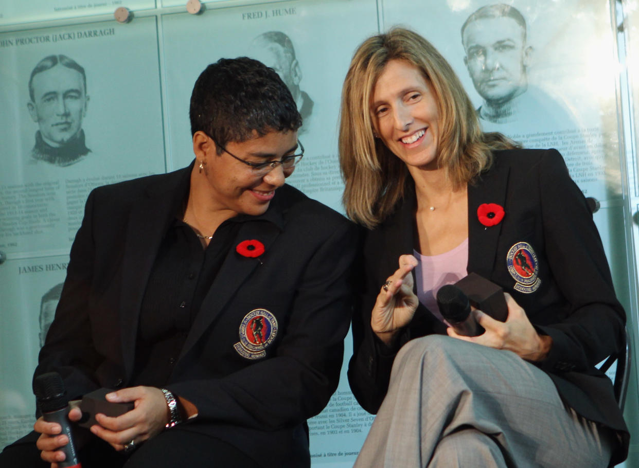 TORONTO, ON - NOVEMBER 08: (L-R) Angela James and Cammi Granato share a moment looking at their new Hall rings at the media opportunity prior to their induction ceremony at the Hockey Hall of Fame on November 8, 2010 in Toronto, Canada. (Photo by Bruce Bennett/Getty Images)