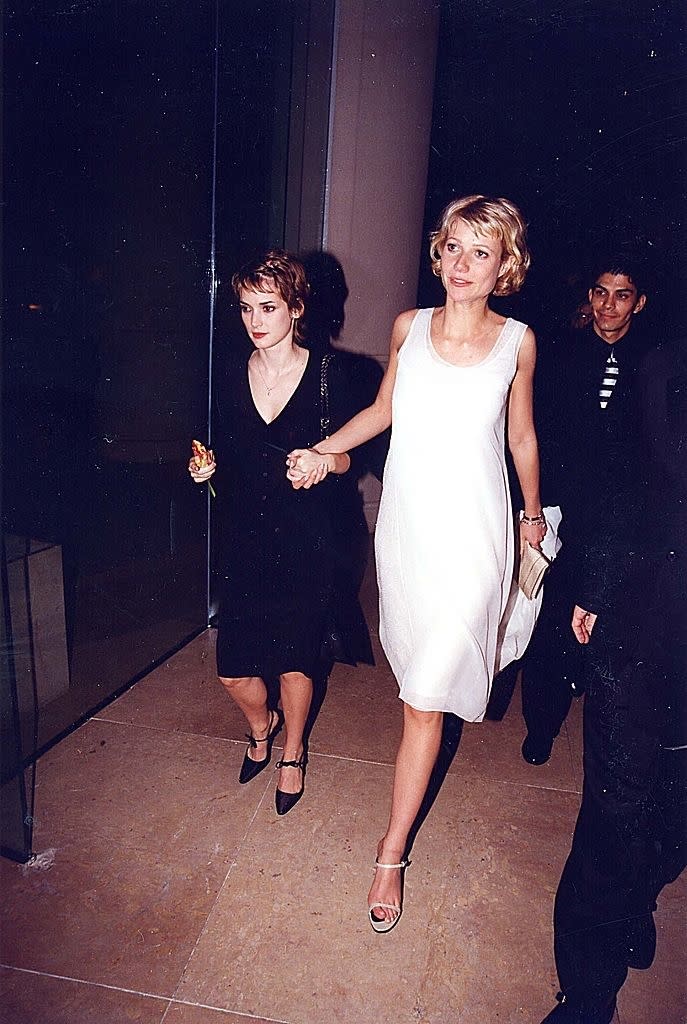 Winona Ryder and Gwyneth Paltrow walking and holding hands