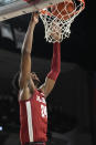 Alabama forward Brandon Miller (24) dunks the ball against Texas A&M during the first half of an NCAA college basketball game Saturday, March 4, 2023, in College Station, Texas. (AP Photo/Sam Craft)