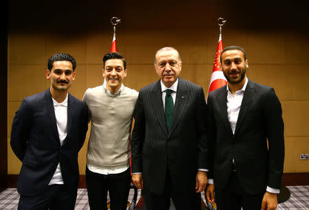 Turkish President Tayyip Erdogan meets with Premier League soccer players Ilkay Gundogan of Manchester City, Mesut Ozil of Arsenal and Cenk Tosun of Everton in London, Britain May 13, 2018. Picture taken May 13, 2018. Kayhan Ozer/Presidential Palace/Handout via REUTERS