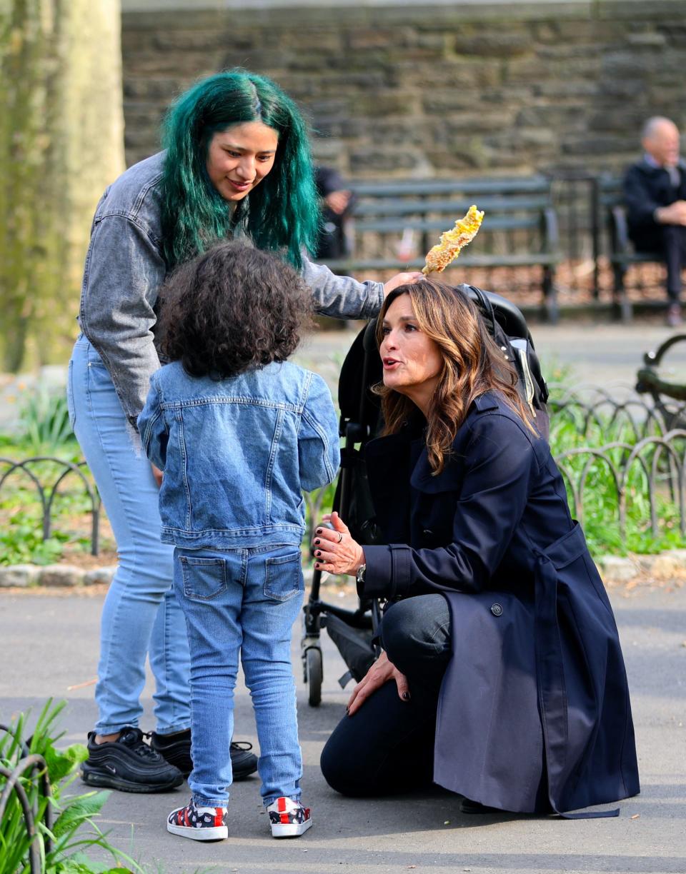 Mariska Hargitay is seen taking a break from filming 'Law and Order: SVU' help a child at the Fort Tryon Playground on April 10, 2024 in New York City.
