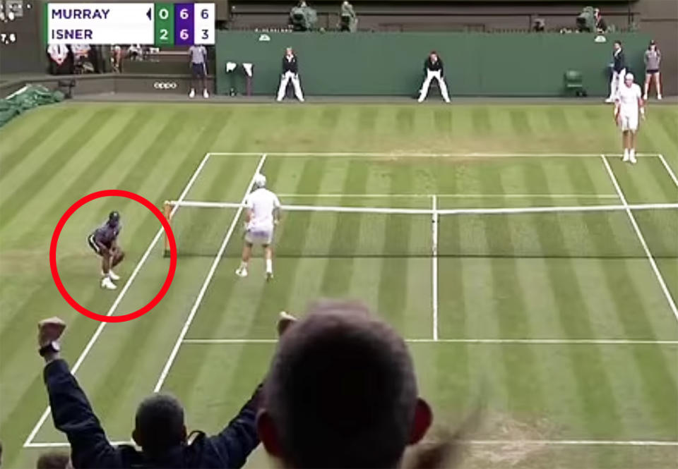 The ball boy, pictured here catching the ball before it bounced during Andy Murray's clash with John Isner.