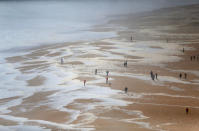 People gather to watch big waves at Praia do Norte in Nazare, Portugal. (Reuters)