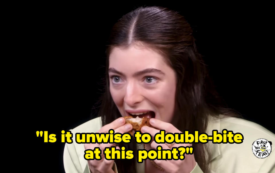 Lorde biting into her wing again and asking, "is it unwise to double bite at this point?"