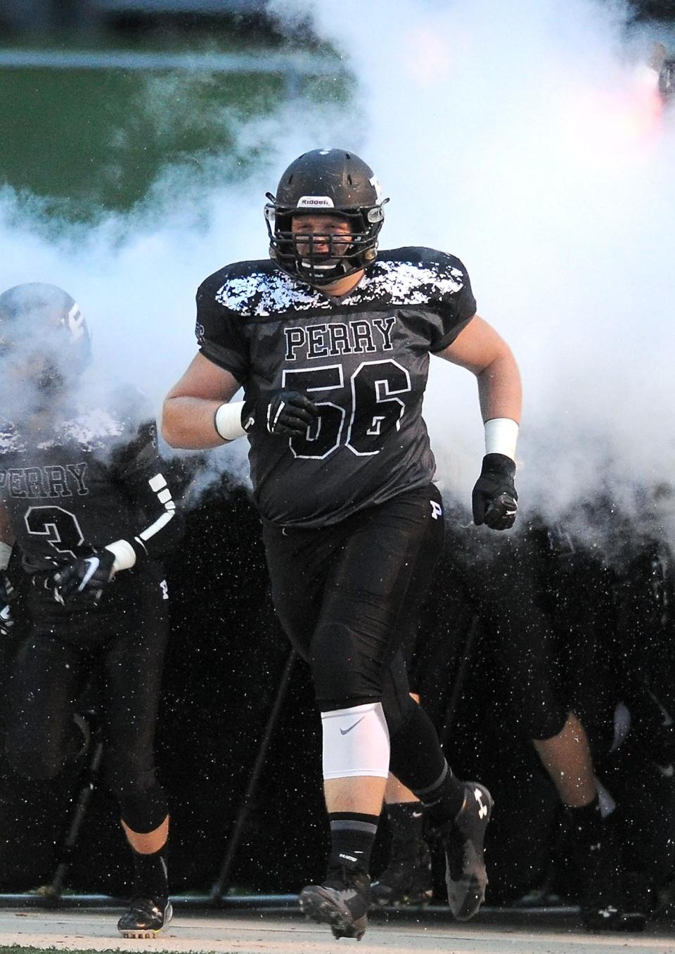 Matt Carrick takes the field for the Perry Panthers when he starred as a high school football player in Stark County.