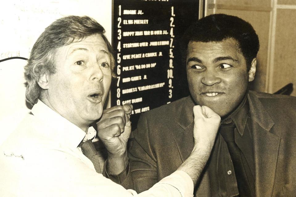 Boxing legend Muhammad Ali jokes around with DJ Michael Aspel