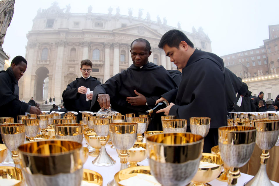 Friars prepare for the communion during the Funeral Mass of Pope Emeritus Benedict (Cardinal Ratzinger) at St. Peter’s Square on Jan. 5, 2023 in Vatican City.<span class="copyright">Franco Origlia—Getty Images</span>