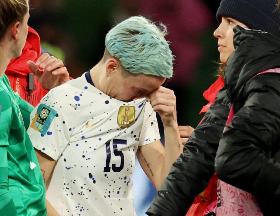 Rapinoe wipes her eyes following the team’s loss (REUTERS)