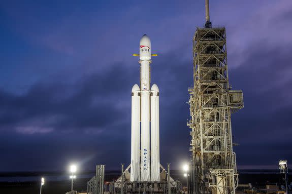 The three-rocket Falcon Heavy sits on a NASA launchpad before the Feb. 6 launch.