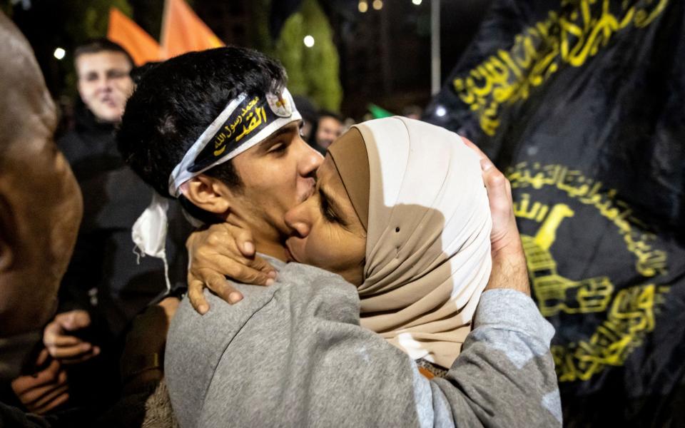 A Palestinian prisoner reacts after being released from an Israeli jail in exchange for Israeli hostages released by Hamas from the Gaza Strip