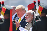 India's Prime Minister Narendra Modi (2R) greets US President Donald Trump upon his arrival at Sardar Vallabhbhai Patel International Airport in Ahmedabad on February 24, 2020. (Photo by MANDEL NGAN / AFP) (Photo by MANDEL NGAN/AFP via Getty Images)