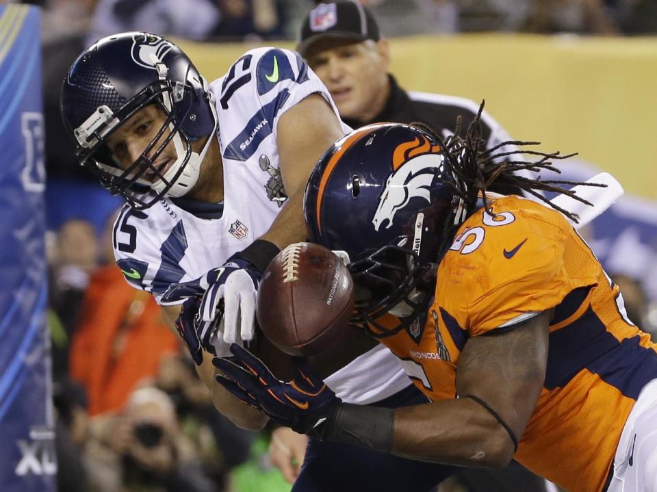 Denver Broncos' Nate Irving, right, breaks up a pass intended for Seattle Seahawks' Jermaine Kearse during the first half of the NFL Super Bowl XLVIII football game Sunday, Feb. 2, 2014, in East Rutherford, N.J. (AP Photo/Matt Slocum)