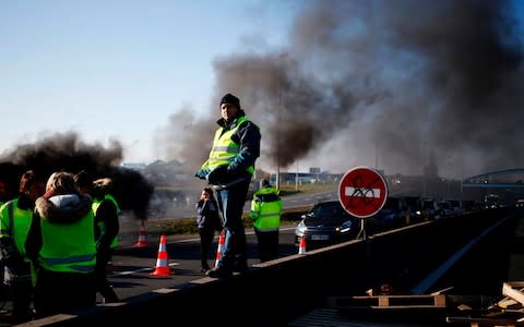 More than 400 people were hurt, 14 seriously, in a day and night of fuel price protests - Credit: CHARLY TRIBALLEAU/AFP/Getty Images