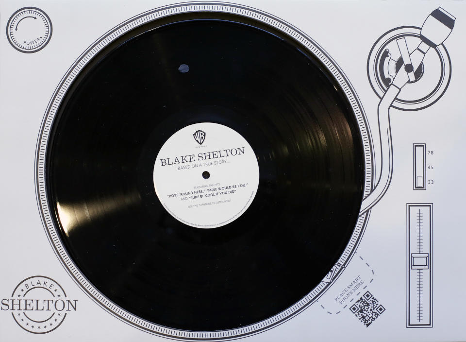 This Oct. 30, 2013 photo shows a virtual record player promoting Blake Shelton that was produced to influence voters of the CMA Awards in Nashville, Tenn. The CMA encourages artists and their labels to educate voters, allowing three email blasts and one mailed product a year. (AP Photo/Mark Humphrey)