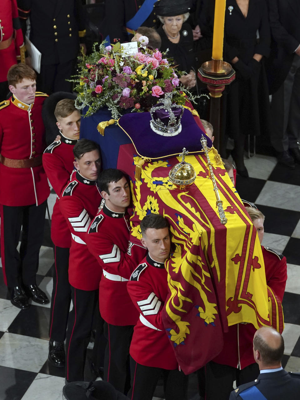 The bearer party with the coffin of Queen Elizabeth II as it is taken from Westminster Abbey, London, Monday, Sept. 19, 2022 at the end of service during the State Funeral of the late monarch. (Gareth Fuller/Pool Photo via AP)