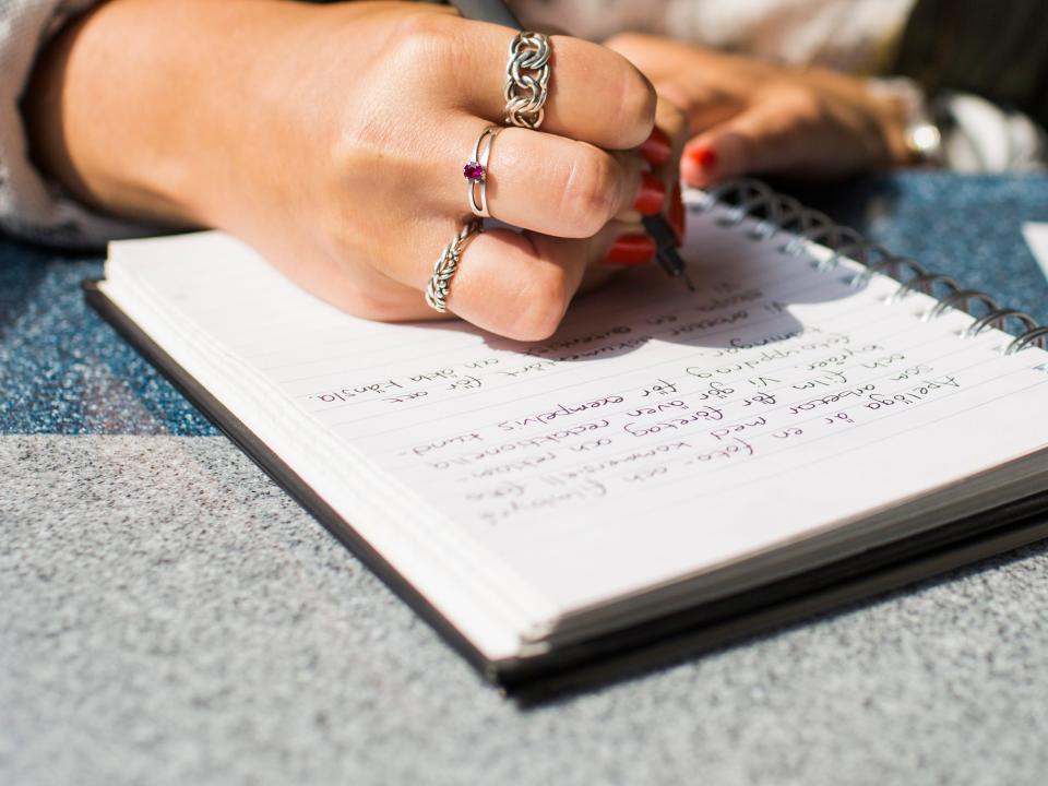 Person writing in a journal