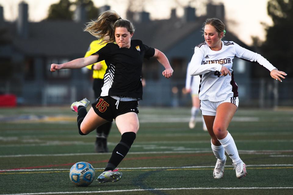 Rocky Mountain girls soccer player Addison Osilka (15) takes a shot on goal during a match against Windsor at French Field in Fort Collins on April 7, 2023. The Lobos won 1-0 in overtime.