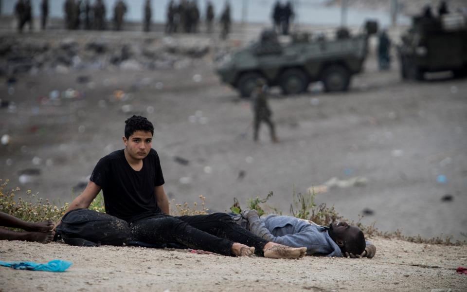 They collapse, exhausted, on the ground afterwards  - Javier Fergo/ AP