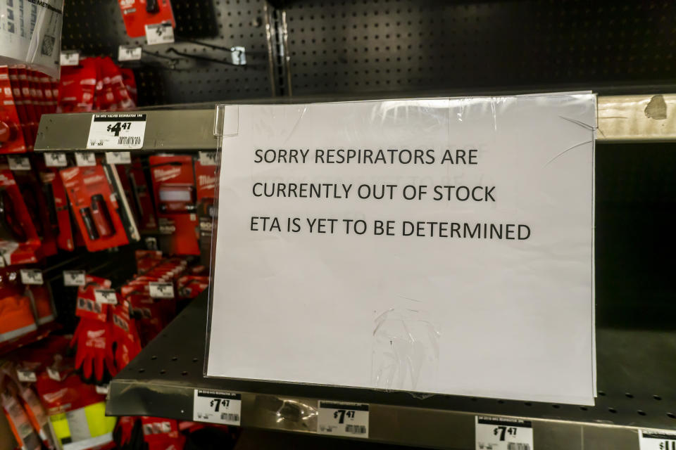 A sign in a New York hardware store on February 27 informs shoppers of the lack of availability of face masks and respirators.