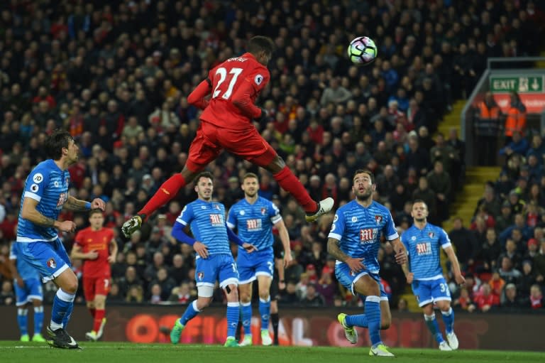 Liverpool's striker Divock Origi jumps to head their second goal during the English Premier League football match between Liverpool and Bournemouth at Anfield in Liverpool, north west England on April 5, 2017