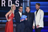 <p>Karlie Kloss, Bobby Bones, Luke Combs, and Brett Young speak onstage at the 51st annual CMA Awards at the Bridgestone Arena on November 8, 2017 in Nashville, Tennessee. (Photo by John Shearer/WireImage) </p>