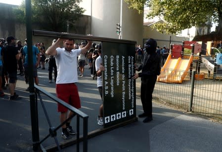 Demonstrators set up a barricade on a street during a protest against G7 summit, in Bayonne