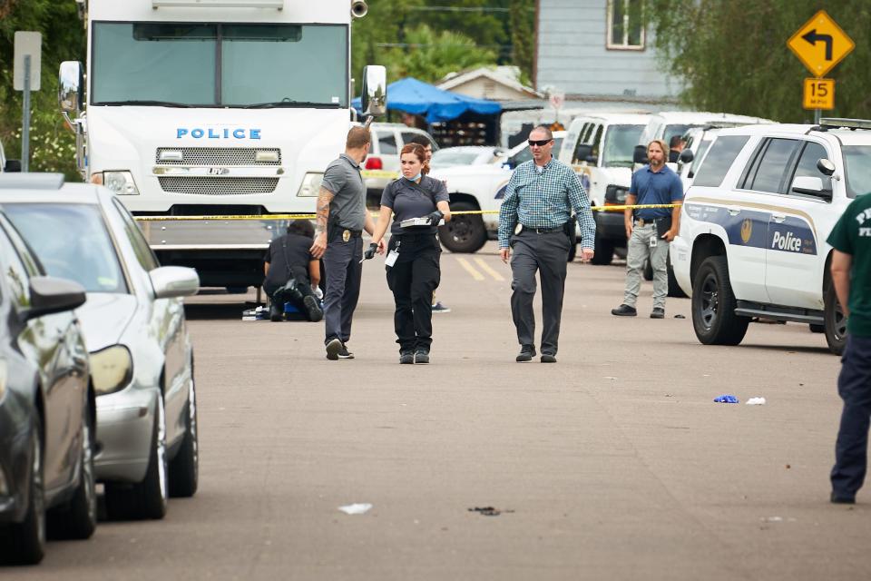 Police work the scene of a shooting that occurred around 2 a.m. near 46th Street and McDowell Road in Phoenix on Aug 14, 2022.