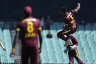 West Indies' Matthew Forde celebrates after bowling out Australia's Steve Smith during their one day international cricket match in Sydney, Sunday, Feb. 4, 2024. (AP Photo/Rick Rycroft)