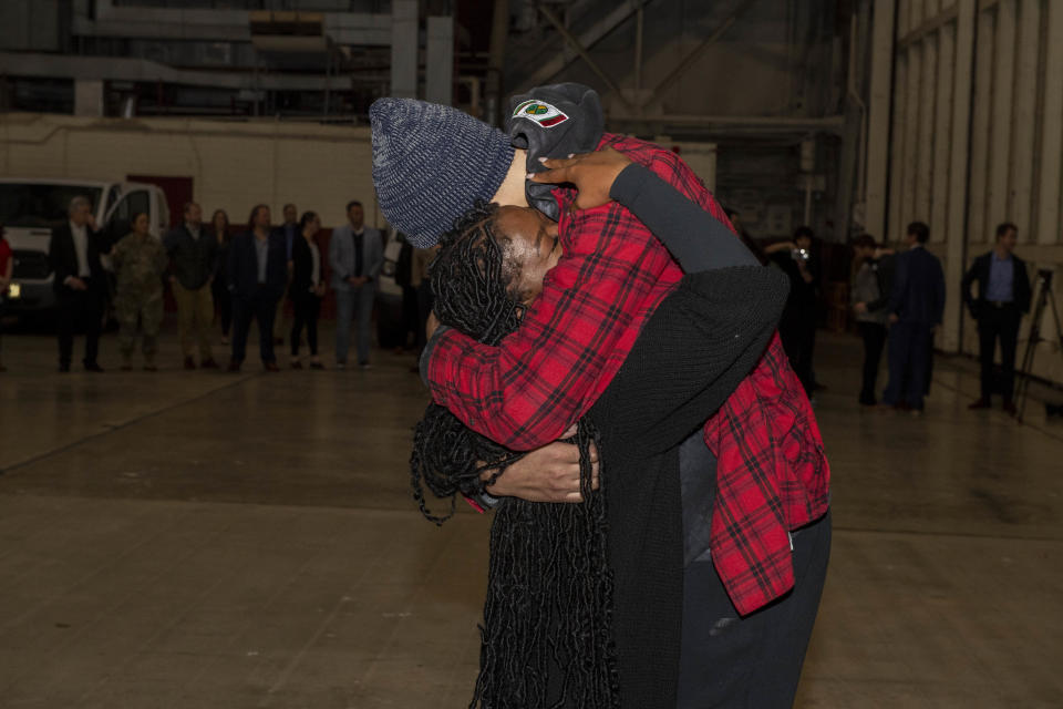 Brittney Griner embraces her wife Cherelle after landing back in the U.S. from Russia. / Credit: US Army Photo by Miguel A. Negron