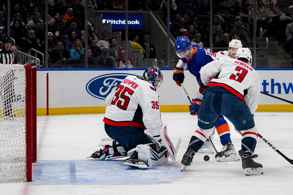 New York Islanders left wing Pierre Engvall looks to shoot at Washington Capitals goaltender Darcy Kuemper (35) during the second period of an NHL hockey game in Elmont, N.Y., Friday, Dec. 29, 2023. (AP Photo/Peter K. Afriyie)