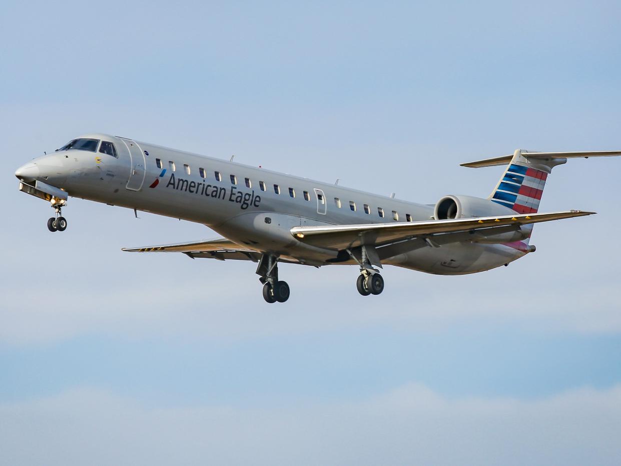 American Airlines Embraer ERJ-145 regional jet aircraft in the sky.