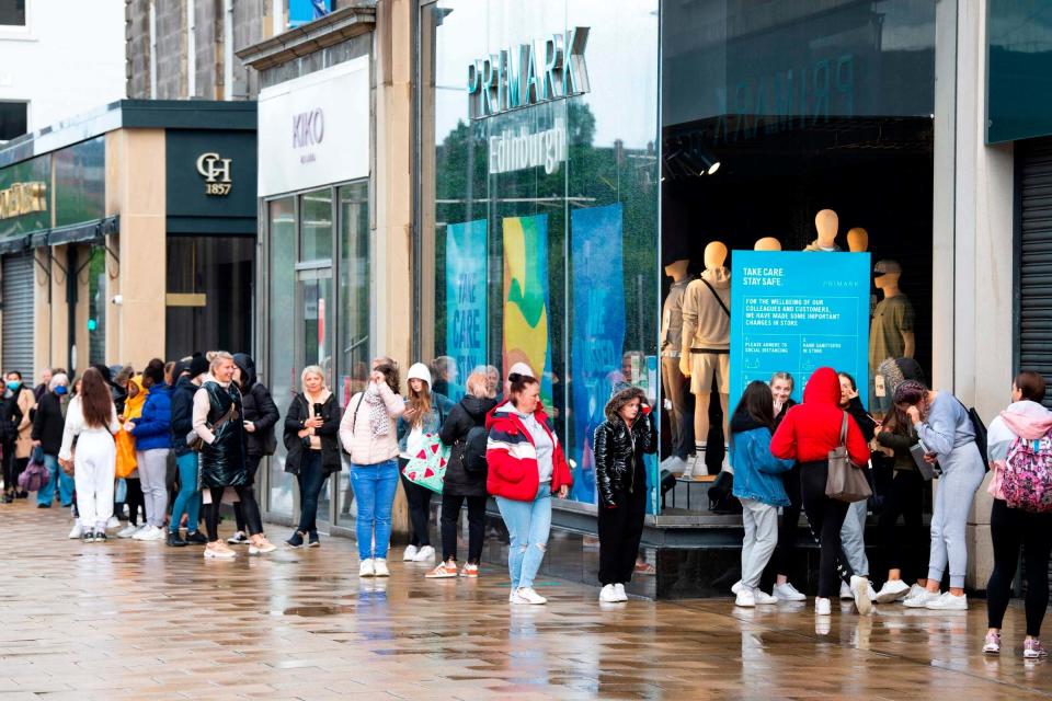 Customers queue outside the Primark store on Princes Street in Edinburgh: AFP via Getty Images