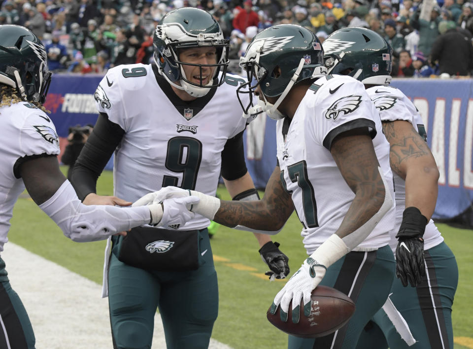 Eagles quarterback Nick Foles tossed an impressive four touchdowns while leading a 13-point comeback win over the Giants in Week 15. (AP Photo/Bill Kostroun)