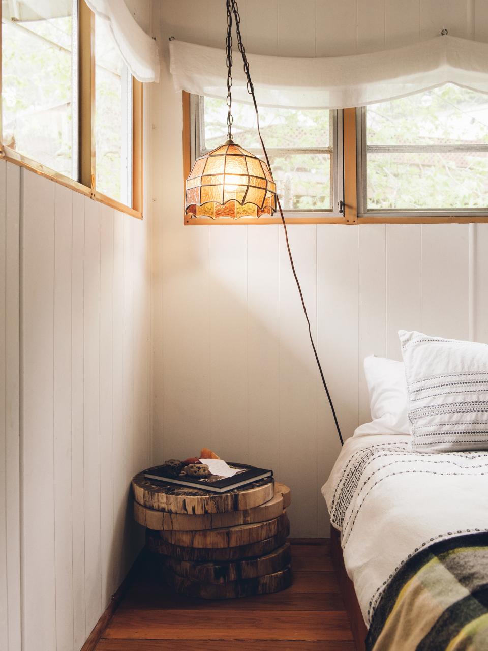 Stacked petrified-wood slabs make for an improvised bedside table.