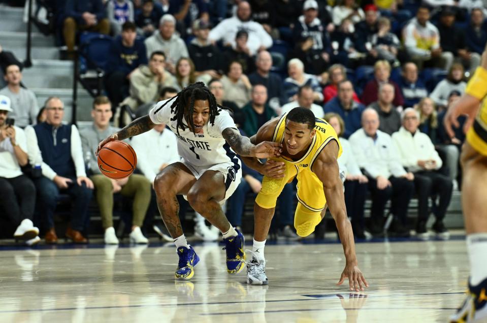 Penn State Nittany Lions guard Ace Baldwin Jr. drives against Michigan Wolverines guard Nimari Burnett in the first half at the Palestra on Jan. 7, 2024, in Philadelphia, Pa.