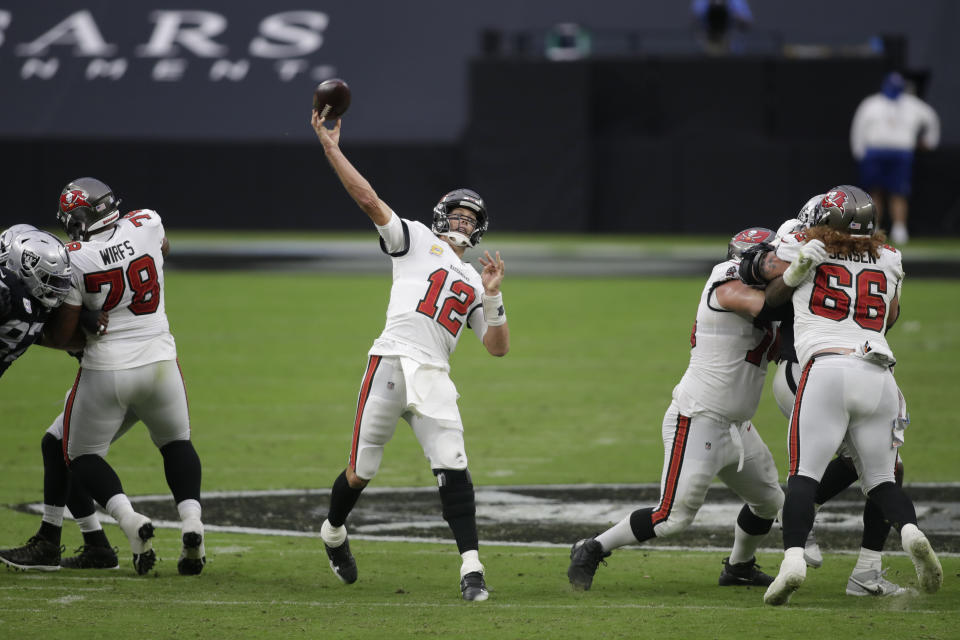Tampa Bay Buccaneers quarterback Tom Brady (12) throws a touchdown pass against the Las Vegas Raiders during the first half of an NFL football game, Sunday, Oct. 25, 2020, in Las Vegas. (AP Photo/Isaac Brekken)