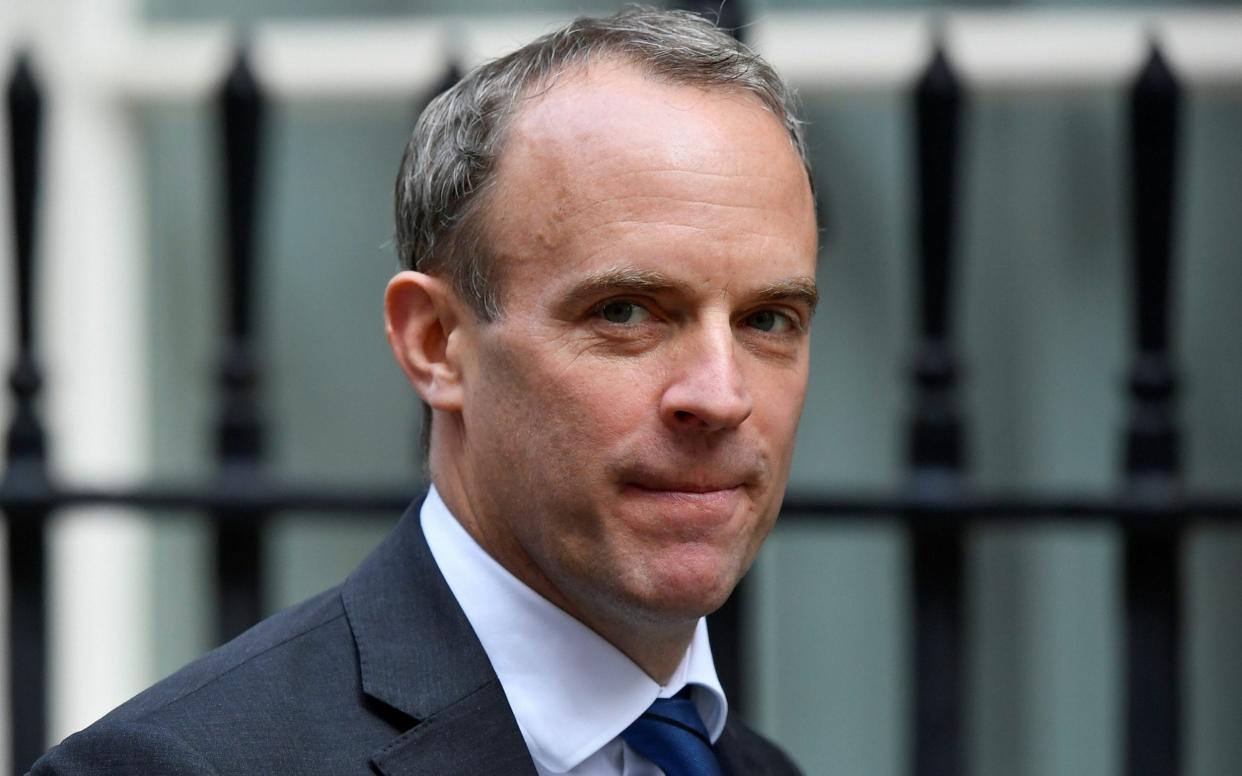 Dominic Raab told LBC that 'vaccine passports' may be introduced to allow visits to shops, restaurants and pubs - Toby Melville/Reuters