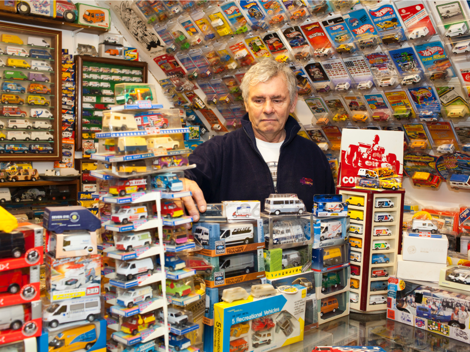 A European posing with his Ford memorabilia collection.